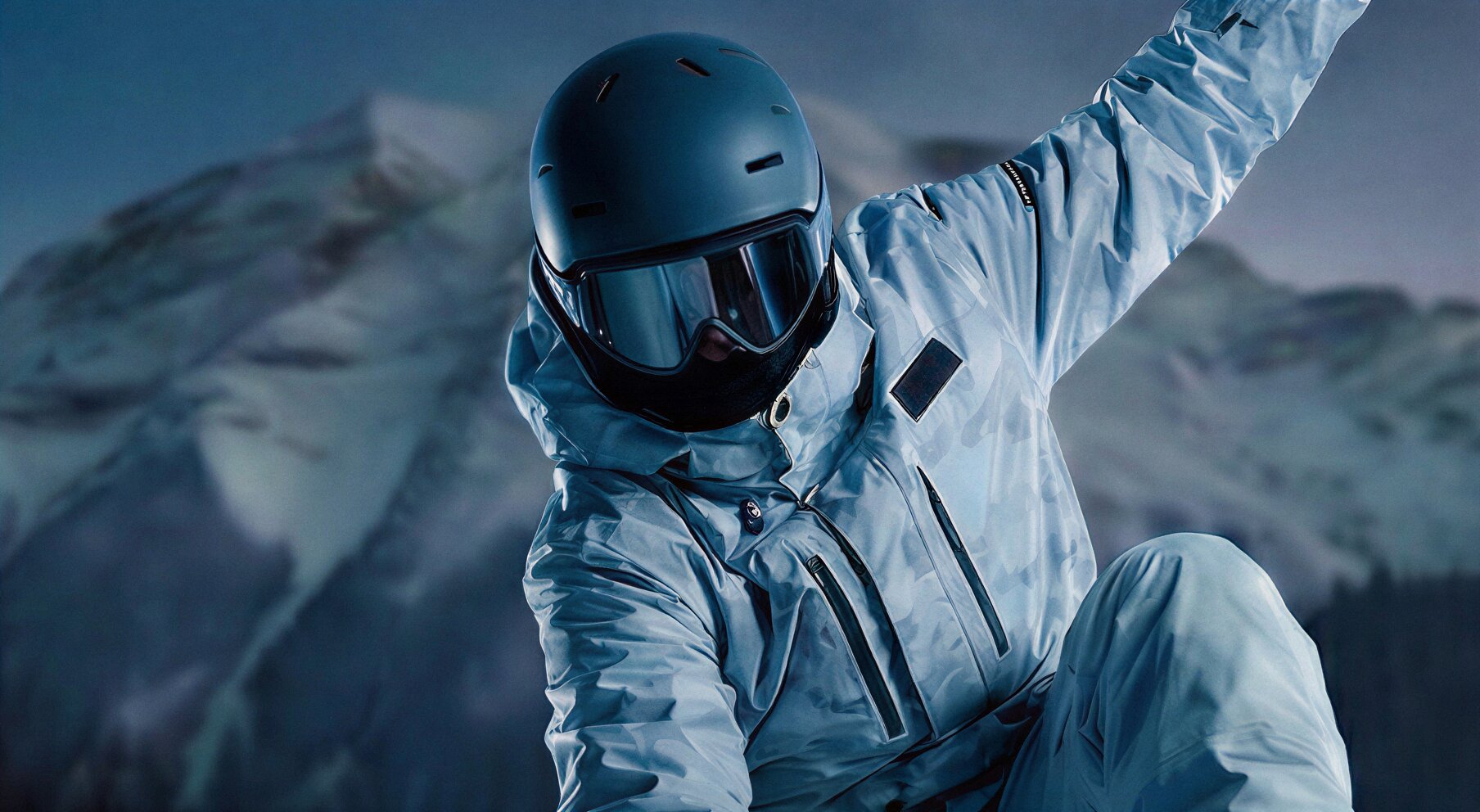 Rider holding the CRYOBOARD carbon fiber snowboard with logo visible.